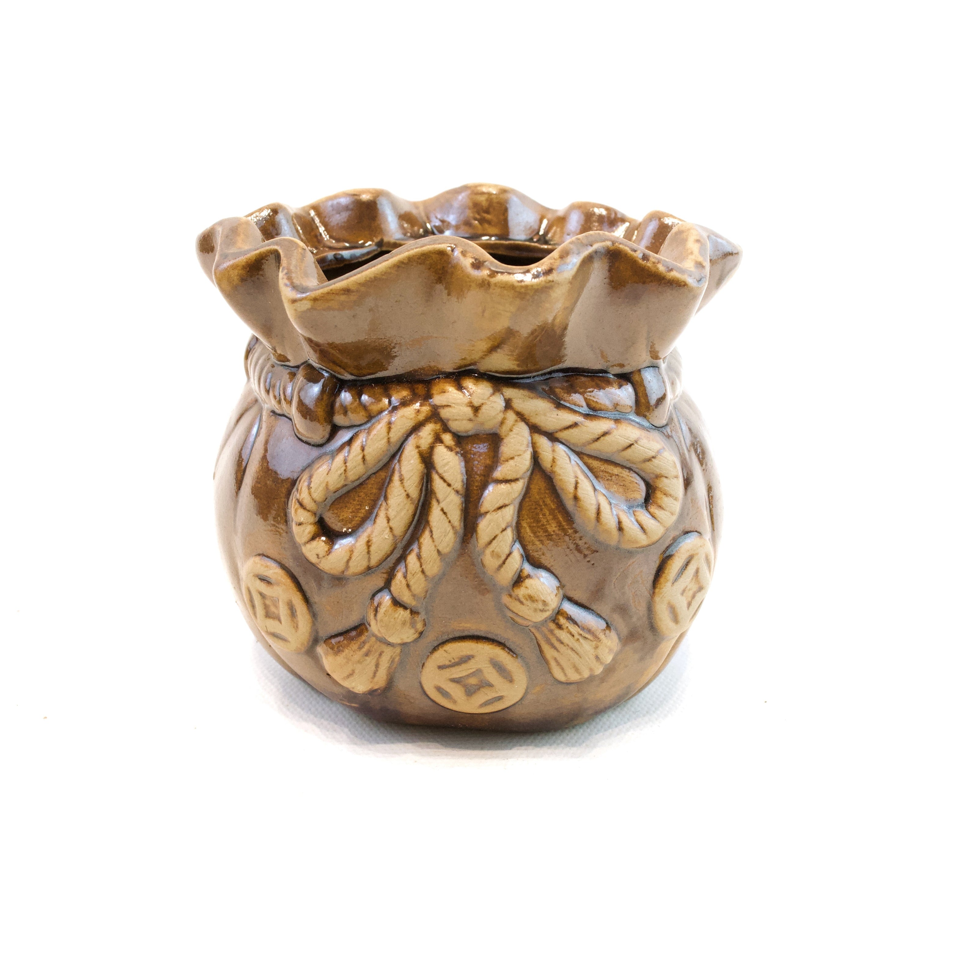 Decorative ceramic vase with intricate designs on a white background