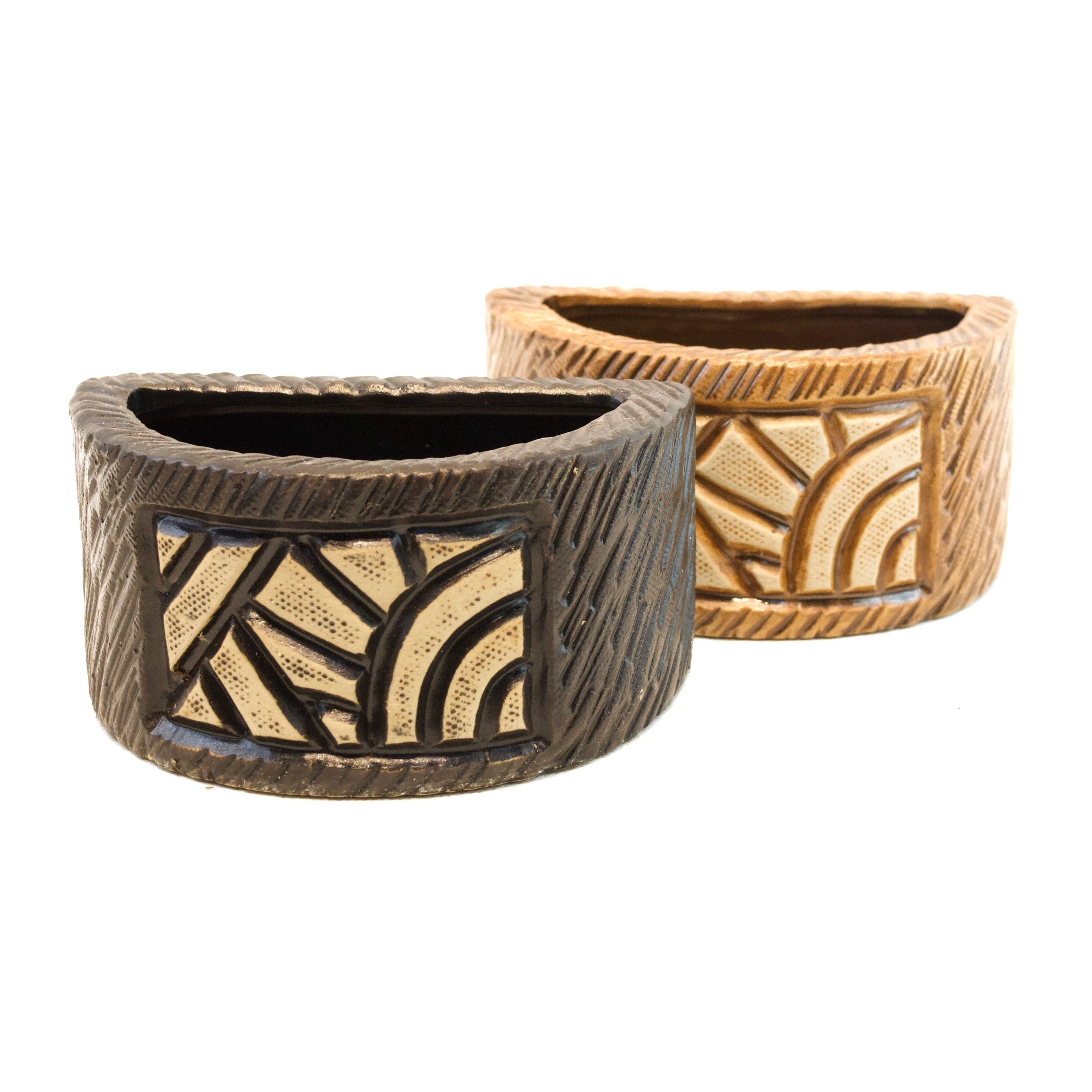 Two decorative planters with geometric patterns on a white background