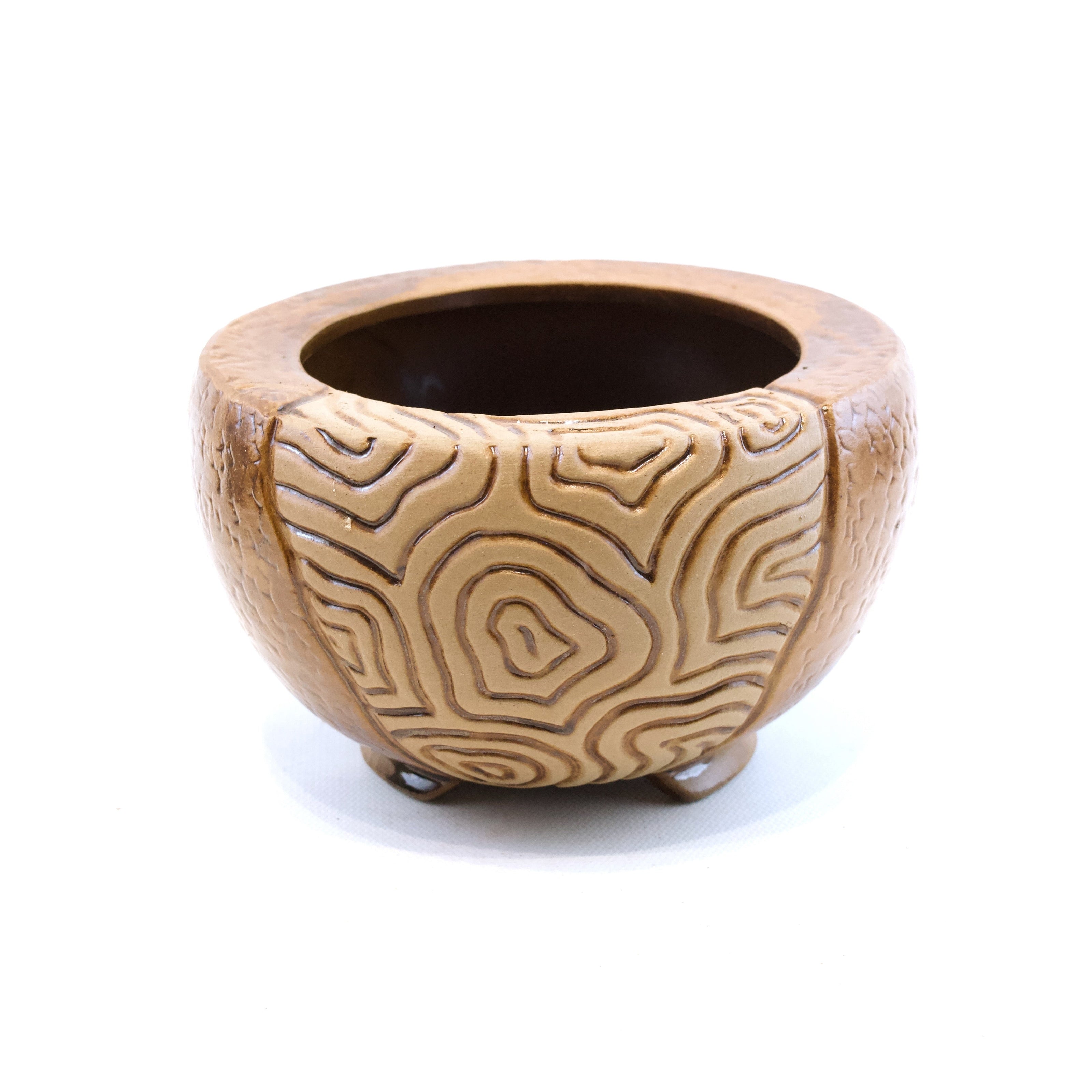Wooden planter with a textured surface on a white background