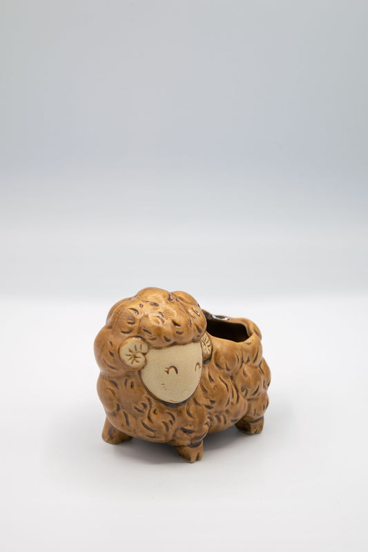 Ceramic sheep/ram/lamb shaped planter on a white background