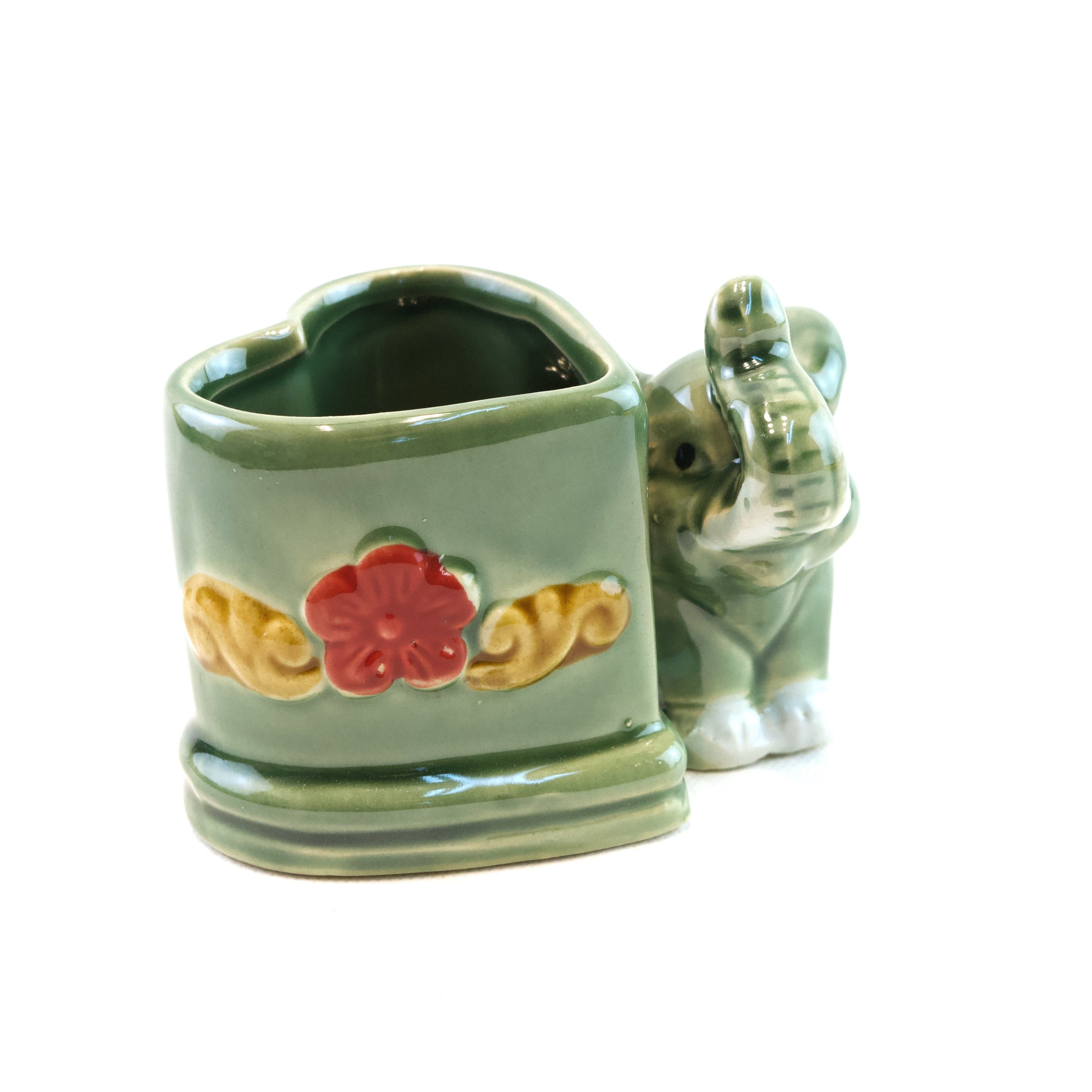 Ceramic planter with a cat design on a white background