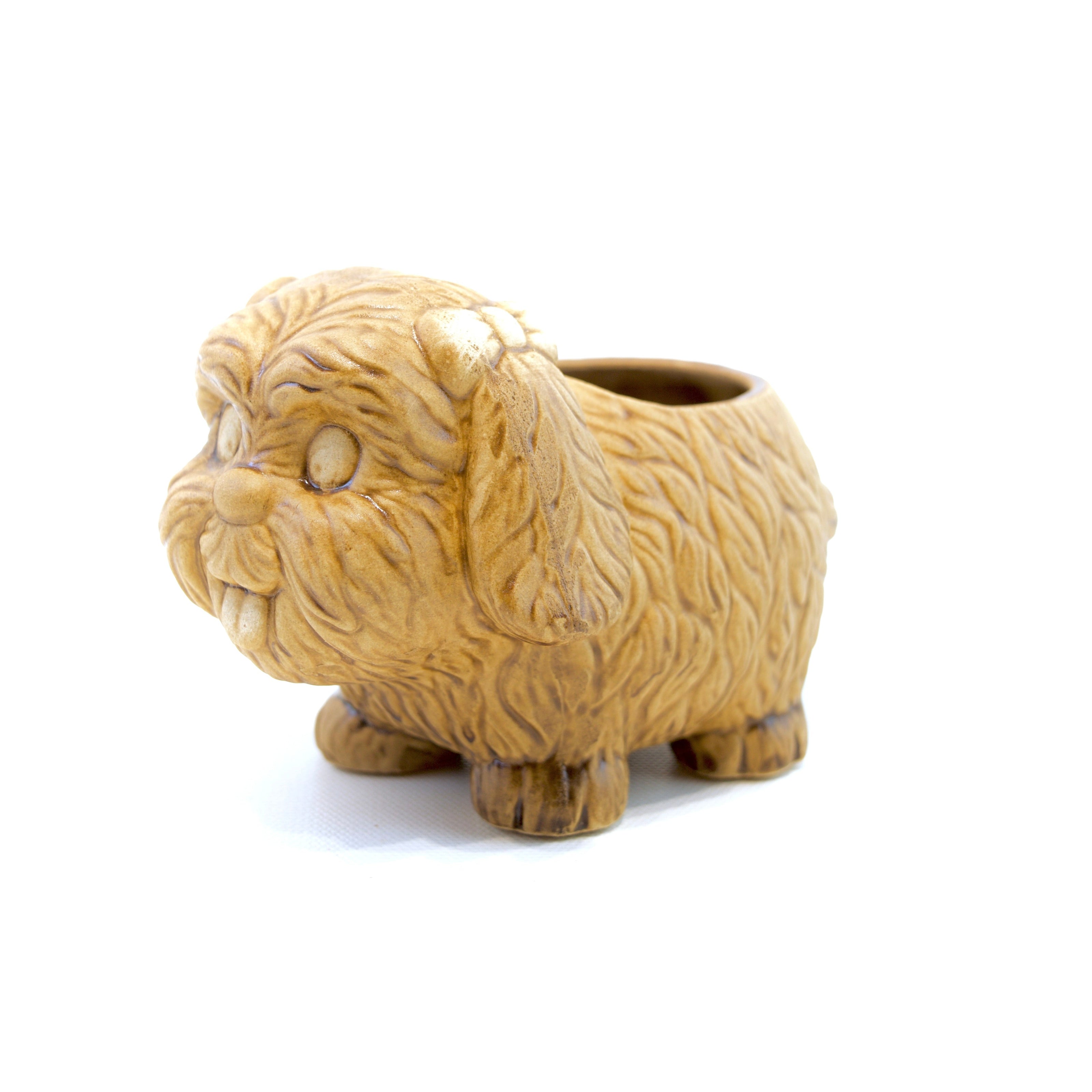 Beige dog-shaped planter on a white background