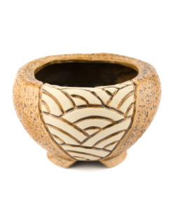 A picture of a front view of a mosaic design round brown planter.