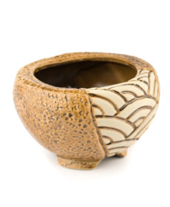 A picture of a side view of a mosaic design round brown planter.
